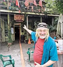  ?? LORI RACKL/CHICAGO TRIBUNE ?? Dave Dardis, shown at his Rainmaker Studio in Makanda, painted a stripe tracing the center line of the eclipse’s “path of totality.”