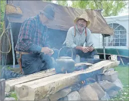  ?? LAWRENCE POWELL ?? The Annapolis River Festival celebrates the river and the heritage connected with it. It was a major waterway for generation­s and more than one split-log campfire was made beside it. This was an authentic display at the festival July 16 at Jubilee Park...