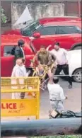  ?? SCREEN GRABS ?? (From left) A group of advocates pushes down a police post signboard outside Saket district court; Lawyers thrash a man who was seen filming lawyers breaking the signboard; a policeman in uniform is cornered, slapped repeatedly and elbowed.