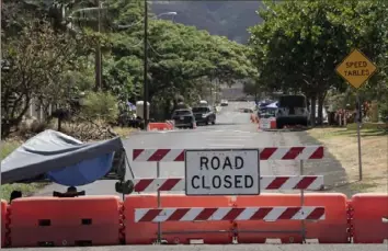  ?? Mengshin Lin/Associated Press ?? A checkpoint set up by the Hawaii National Guard is pictured Sunday in Lahaina, Hawaii. Kaniau Road of Zone 1C was the first zone to be cleared for residents to re-enter starting Monday, following Maui’s deadly wildfire.