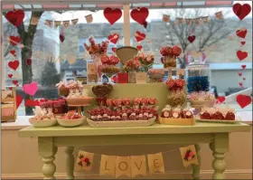  ?? PHOTO COURTESY ANNIE MALONEY ?? Sweet Annie’s Candy Shoppe window is decorated in style for this upcoming Valentine’s Day.