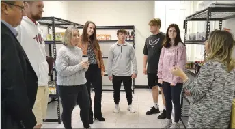  ?? TIMES photograph by Annette Beard ?? School Board members Adam Yager, Mindy Cawthon and Sarah Saragusa joined superinten­dent Keith Martin on a tour of the Blackhawk Pantry recently. Students Jason Beyer, Jayden Spivey and Clovis Hance are interns who help in the pantry.