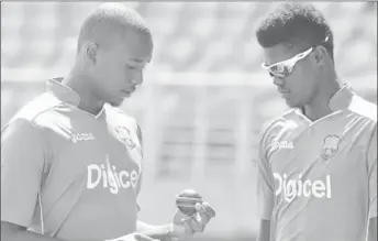  ?? (Photo courtesy WICB) ?? WEST INDIES – Jason Holder (captain), YOUNG BRIGADE: Uncapped fast bowlers Miguel Cummins (left) and Alzarri Joseph discuss plans during training.