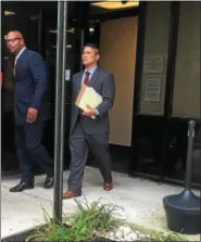  ?? DAN SOKIL — DIGITAL FIRST MEDIA ?? Derrick Cosby of Hatfield, at left, leaves district court in Montgomery Township with attorney Edward Galang, at right, after waiving a preliminar­y hearing on charges stemming from a July shooting.