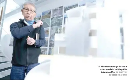  ?? AP PHOTO/ EUGENE HOSHIKO ?? Riken Yamamoto speaks near a scaled model of a building at his Yokohama office.