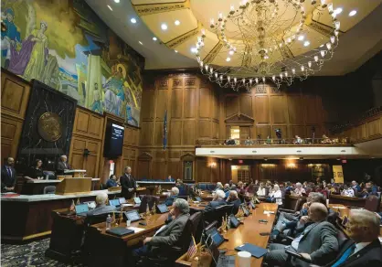  ?? JENNA WATSON/AP ?? Members of the House listen during a special session in July at the Indiana Statehouse in Indianapol­is.