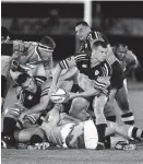  ?? Photo / John Stone ?? Northland fullback Hayden Taylor fires off a pass from the base of a ruck against Central Vikings in the 1997 final.