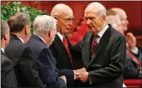  ?? The Associated Press ?? MORNING SESSION: In this Sept. 30, 2017, file photo, Russell M. Nelson, right, president of the Quorum of the Twelve Apostles, greets members of the Quorum before the start of the morning session of the two-day Mormon church conference in Salt Lake...