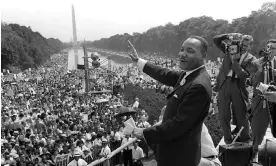  ?? Photograph: AFP/Getty Images ?? Martin Luther King Jr waves to supporters from the steps of the Lincoln Memorial, on 28 August 1963.