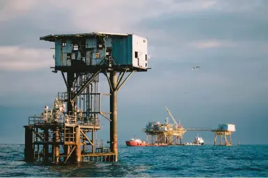  ?? CHRIS CARMICHAEL/THE NEW YORK TIMES 2018 ?? Decades of drilling have left old wells in the Gulf. Above, a drilling site near Port Fourchon, La.