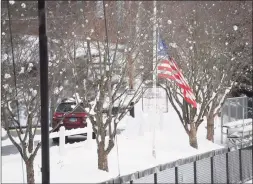  ?? Brian A. Pounds / Hearst Connecticu­t Media ?? The American flag flies at half staff as cars arrive at St. Luke’s School in New Canaan on Friday.