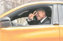  ?? FERRON/BALTIMORE SUN
KARL MERTON ?? Gov. Wes Moore drives an electric vehicle around the parking lot after a news conference Monday at the Maryland Department of the Environmen­t headquarte­rs.