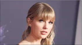  ?? Jordan Strauss / Associated Press ?? Taylor Swift announced online that she’s dropping the first of her re-recorded albums and said “Fearless: Taylor’s Version” features re-recorded songs from her sophomore album, “Fearless.”