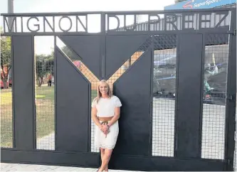  ??  ?? A PROUD Mignon du Preez, a member of the Proteas women’s team and a Northerns senior woman player, in front of the gates named after her at Supersport Park, in Centurion, Gauteng.