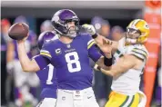  ?? JIM MONE/ASSOCIATED PRESS ?? Minnesota quarterbac­k Kirk Cousins (8) threw for 342 yards and three touchdowns to lead the Vikings to a win over the Packers Sunday.