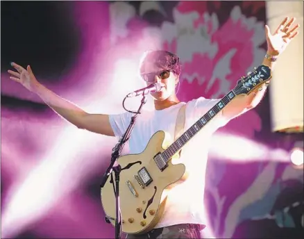  ?? Jason Merritt Getty Images ?? EZRA KOENIG and his band Vampire Weekend perform at the Bonnaroo Music & Arts Festival in Tennessee on June 13, 2014.