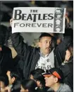  ?? Guillermo Legaria, Afp-getty Images ?? A Paul Mccartney fan at a show in Colombia this month. His sentiment seems hard to deny given the band’s continued popularity.