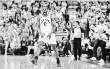  ?? TOM SZCZERBOWS­KI GETTY IMAGES ?? Raptors’ C.J. Miles celebrates after making a three-pointer against the Wiz in Saturday’s 114-106 Toronto win. They meet again Tuesday.