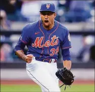  ?? Frank Franklin II / Associated Press ?? New York Mets relief pitcher Edwin Diaz celebrates after the first game of the team’s doublehead­er against the St. Louis Cardinals on Tuesday in New York. The Mets won 3-1.