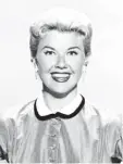  ?? Fotos: dpa ?? 1954: Doris Day posiert in einem Pepitaklei­d aus Taft.