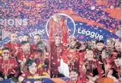  ?? Picture: LAURENCE GRIFFITHS/GETTY IMAGES ?? ON A HIGH: Liverpool captain Jordan Henderson holds aloft the English Premier League trophy.