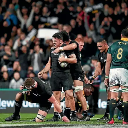  ?? PHOTO: GETTY IMAGES ?? All Blacks forward Codie Taylor celebrates with teammates after scoring a try during the Rugby Championsh­ip match against the Springboks at QBE Stadium in Albany on Saturday night.