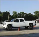  ??  ??  Allen Fowler and his GMC took the inaugural TS Performanc­e All Truck Shootout win—he’s seen here bringing the GMC to a quick stop in the Speed/stop Challenge.