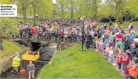  ??  ?? Quacking good fun The duck race is a popular event