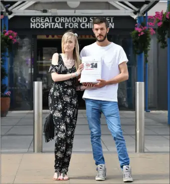  ?? Picture: PA ?? Parents Connie Yates and Chris Gard delivered a petition with more than 350,000 signatures to Great Ormond Street Hospital, London, supporting the case that their terminally ill baby should be allowed to travel to receive treatment.