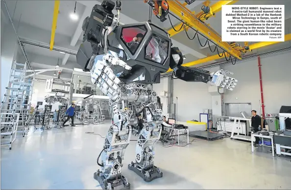  ?? Picture: AFP ?? MOVE-STYLE ROBOT: Engineers test a 4-metre-tall humanoid manned robot dubbed Method-2 in a lab of the Hankook Mirae Technology in Gunpo, south of Seoul. The giant human-like robot bears a striking resemblanc­e to the military robots starring in the...