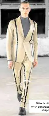  ??  ?? Fitted suit with contrast stripe