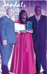  ?? CONTRIBUTE­D ?? Shenade Quarrie collects her awards from resort General Manager David Latchimy (left) and hotel manager, O’Brian Heron, after being named Diamond Team Member of the Year 2019 at the annual Prestige Awards.