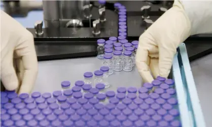  ??  ?? Vials of a coronaviru­s vaccine candidate are sorted at a Pfizer facility in Puurs, Belgium. Photograph: Pfizer/Reuters