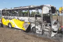  ??  ?? A PASSENGER bus in Mindanao burned by suspected NPA members.