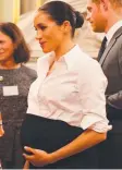  ??  ?? Meghan Markle holds her baby bump at an event yesterday.