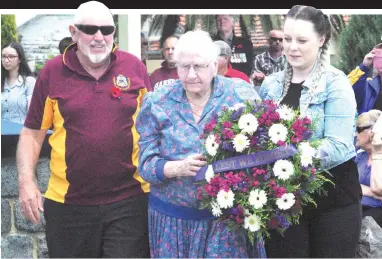  ??  ?? Sylvia Hill was born the same year World War I began and was just three-years-old when hostilitie­s ceased on the Western Front and the Armistice was signed to end WWI. On Sunday, at 103-years-old, Sylvia (centre) was assisted by her son Graham Hill and great-grand daughter Jordyn Ralls when she laid a wreath on behalf of Legacy at the Trafalgar service. Photograph: Yvette Brand