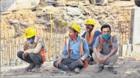  ??  ?? Migrant workers at a constructi­on site at Pragati Maidan.