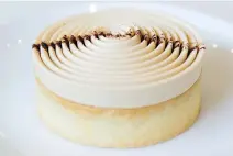  ??  ?? The beautiful chocolate-coffee tartelette was rich and delicately flavoured, with thick Chantilly cream spiralled on top.