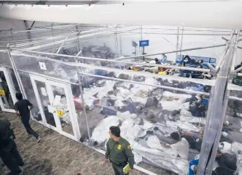  ?? DARIO LOPEZ-MILLS/AP ?? Minors rest inside a pod at the Donna Department of Homeland Security holding facility March 30 in Donna, Texas. More Americans disapprove of how President Joe Biden’s administra­tion is handling the waves of immigratio­n.