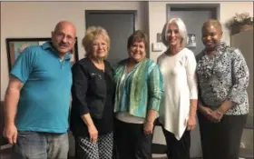  ?? BRIANA CONTRERAS — THE MORNING JOURNAL ?? From left: Volunteer of NAMI Lorain County Art Weiss; NAMI Executive Director Claire Cygan Young; NAMI Board President Chris Kish; administra­tive assistant to Young, Christine Groomes-Alarcon; and board member Betty J. Weaver pose for a photo at an...