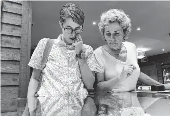  ?? Gillian Flaccus / Associated Press ?? Cindy Paul, 55, and daughter Doc, 31, both of Billings, Mont., shop for marijuana edibles at a marijuana retail store in Portland, Ore. They reject the “stoner” images often portrayed today.