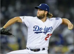  ?? MARK J. TERRILL — THE ASSOCIATED PRESS ?? Los Angeles Dodgers starting pitcher Clayton Kershaw throws to an Arizona Diamondbac­ks batter during first inning of Game 1 of a baseball National League Division Series in Los Angeles, Friday.