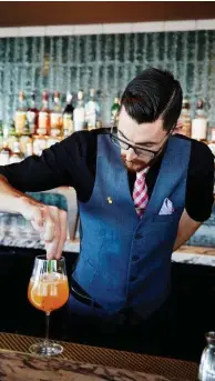  ??  ?? Right: lime custard, toffee and ice-cream at Bea. Below: bartender Pauric Kennedy makes a Summer Spritz at Smoke (right).