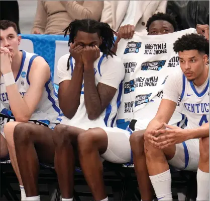  ?? GENE J. PUSKAR — THE ASSOCIATED PRESS ?? Players on the Kentucky bench watch late in the second half of the team’s college basketball game against Oakland in the first round of the men’s NCAA Tournament in Pittsburgh, Thursday. Oakland won 80-76.