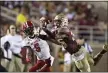  ?? MARK WALLHEISER — THE AP ?? Florida State’s Asante Samuel Jr. (26) tries to intercept a pass intended for North Carolina State’s Tabari Hines during a 2019 game.