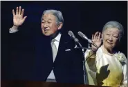  ?? AP/EUGENE HOSHIKO ?? Japan’s Emperor Akihito and Empress Michiko wave to well-wishers at a New Year’s Day appearance at the Imperial Palace in Tokyo.