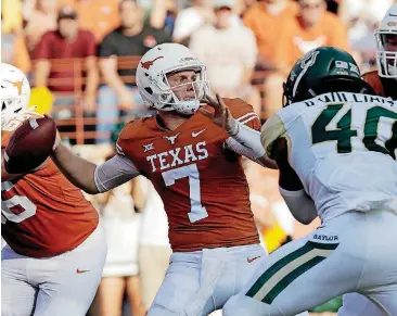  ?? [AP PHOTO] ?? Texas quarterbac­k Shane Buechele throws against Baylor on Saturday in Austin.