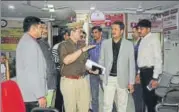  ??  ?? (From left) Police officials at UBI’S Pashupati Nagar branch; The robbers emptied 26 lockers.