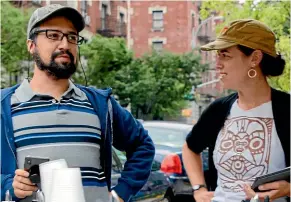  ??  ?? Lin-Manuel Miranda and Quiara Alegria Hudes, the duo behind the Tony-winning musical, confer on set of In the Heights.