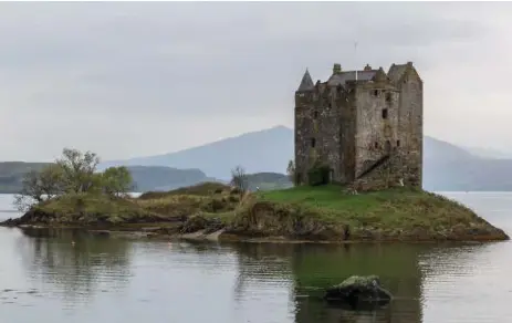  ?? THOMAS HALL PHOTOS ?? Castle Stalker was built in the mid-1400s on the site of an earlier fort. Driving along the west coast of Scotland, you soon come across such views.